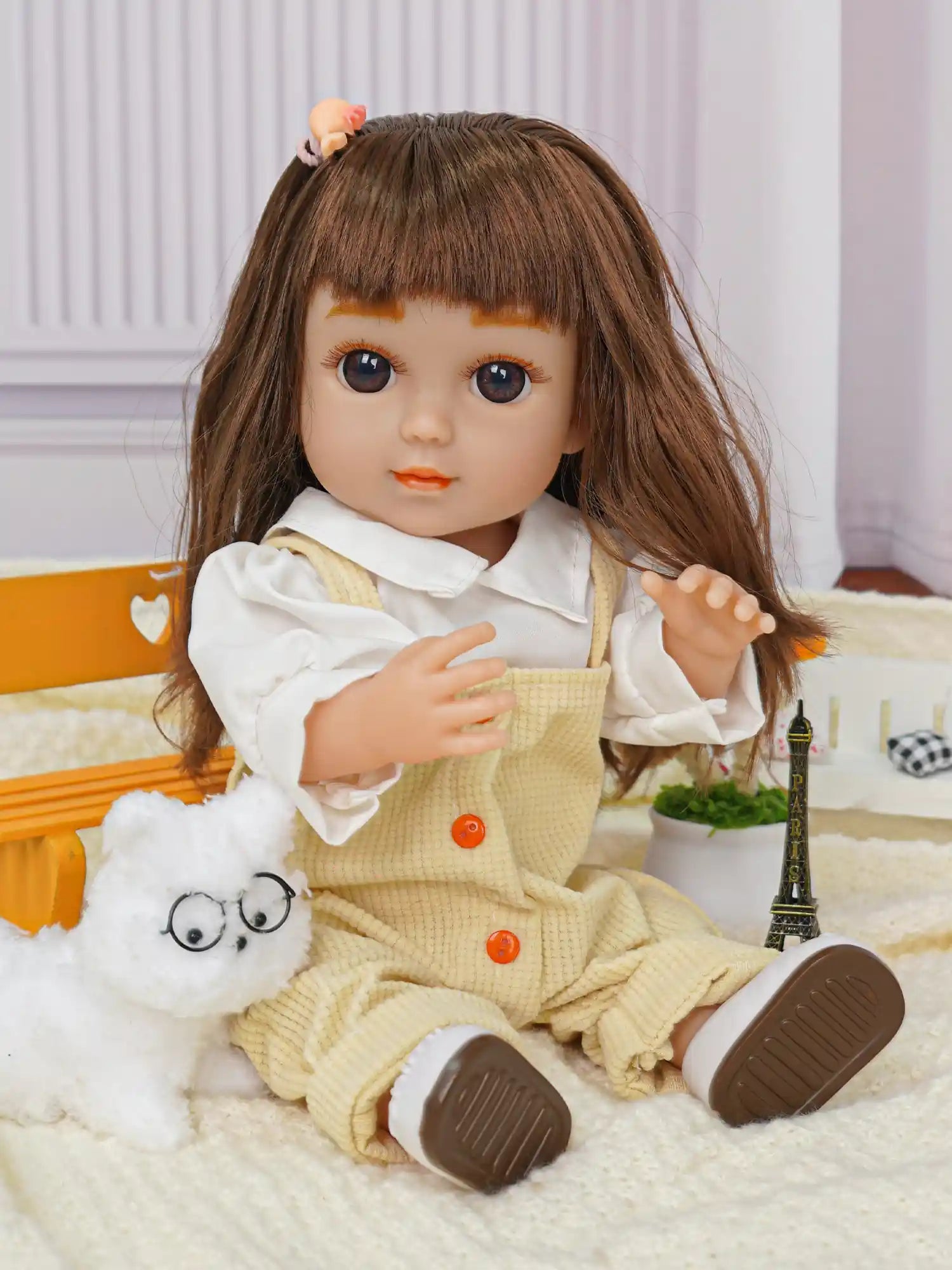 Doll in casual wear with a white dog toy and Parisian souvenir.