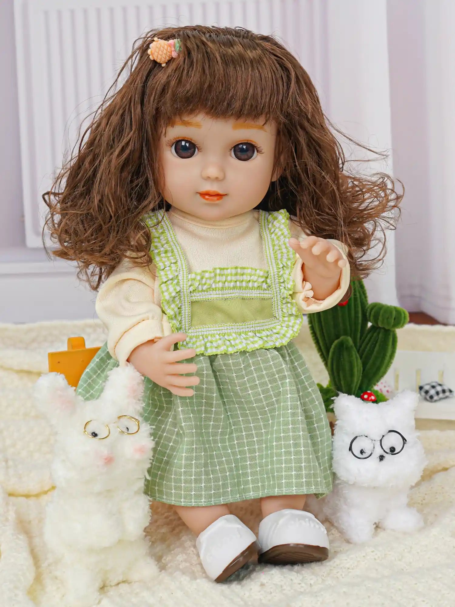 Doll with wavy brown hair, green checked dress, with plush dog and cactus.