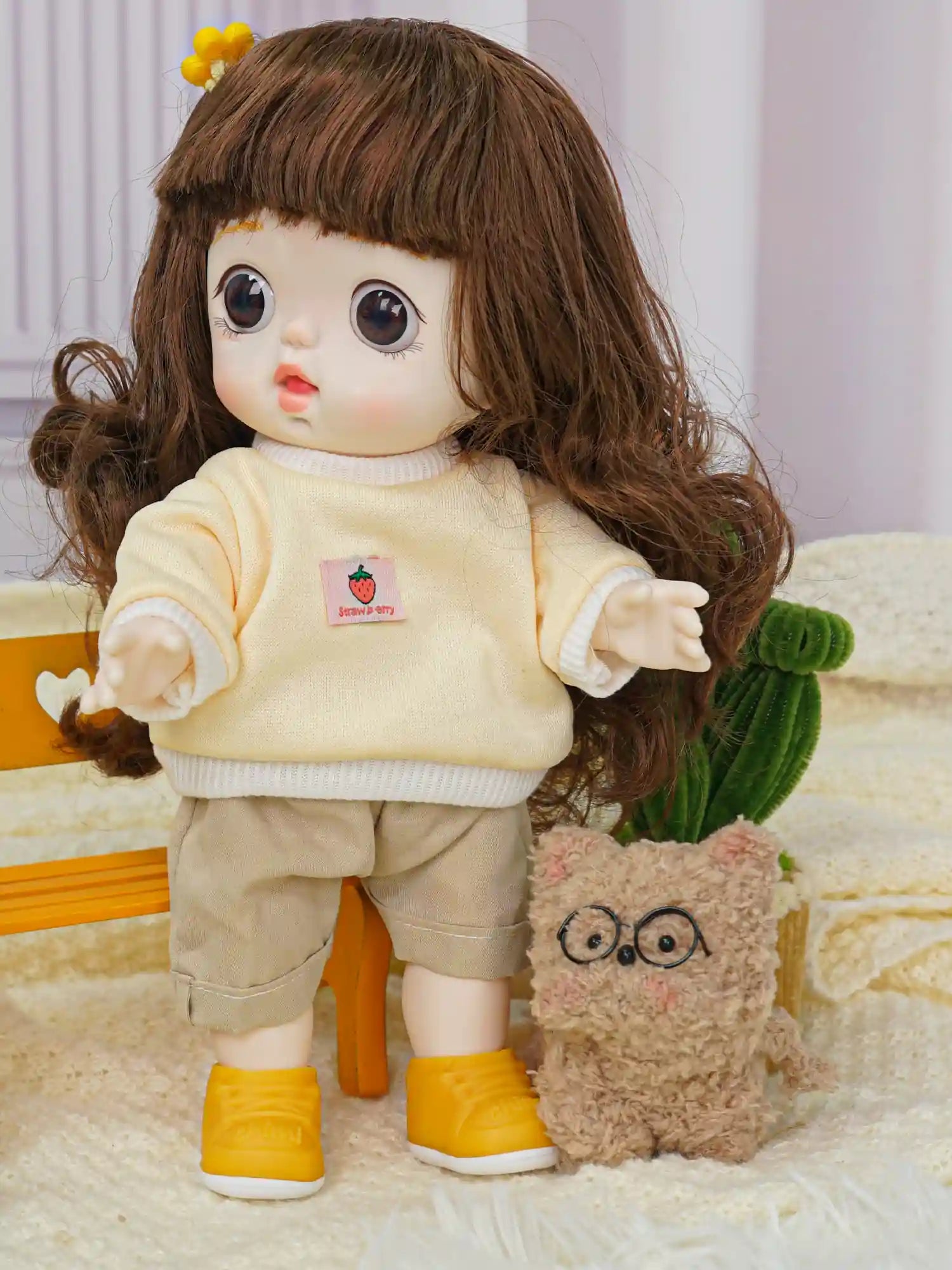 Playful doll with a fringe, clad in a warm sweater and rolled up pants, next to a plush toy in a playful setting.