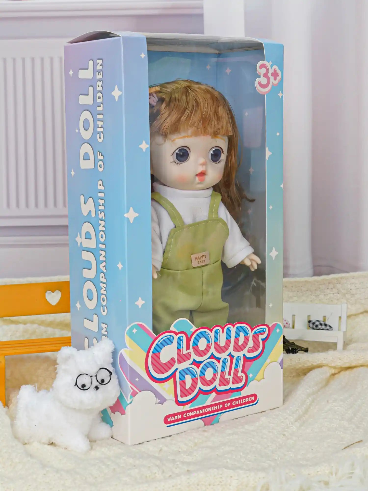 A charming doll with a cozy look, paired with a playful toy cat in glasses and a toy car on the side.