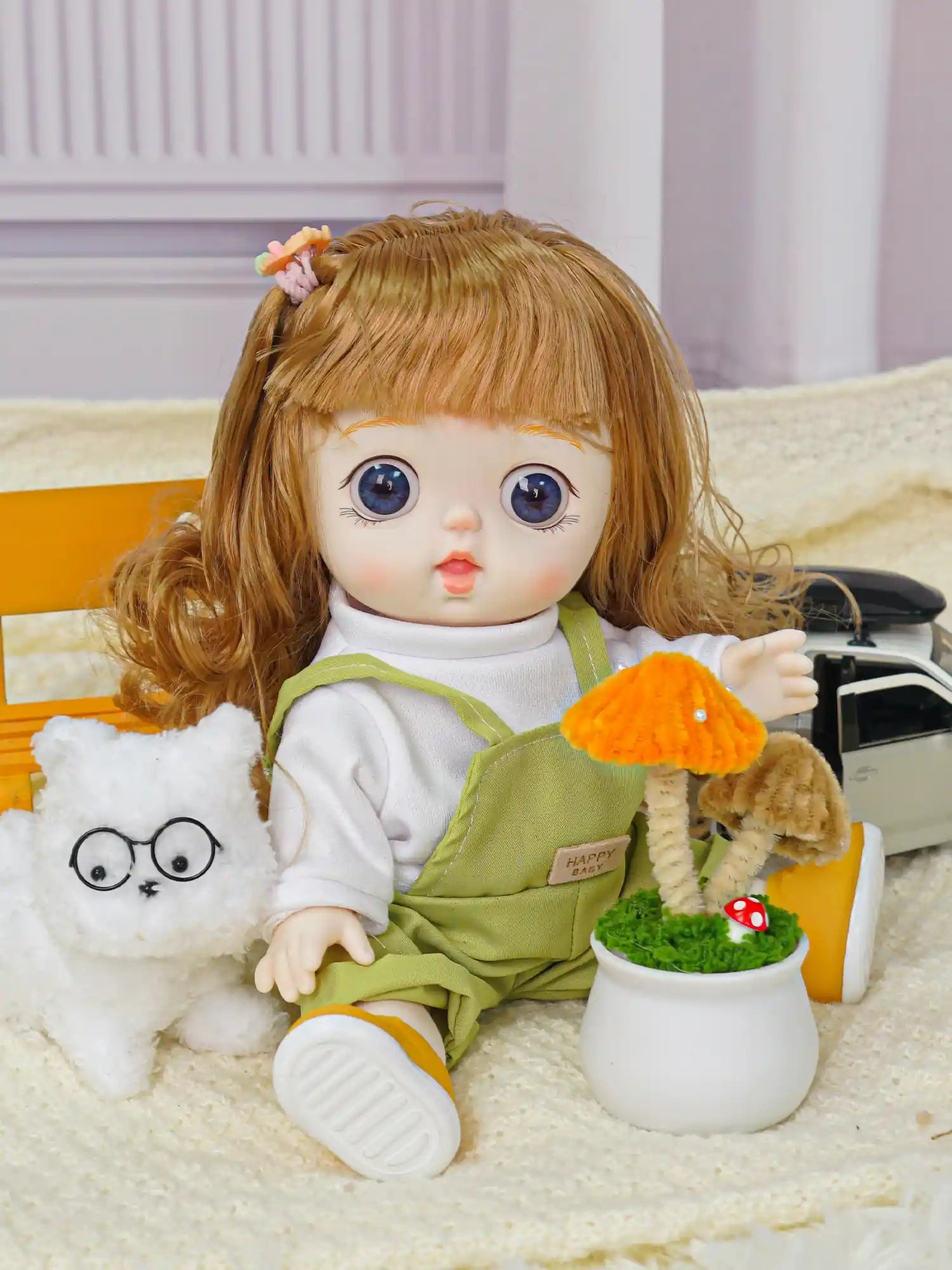 Young doll with flowing hair and outdoor attire, beside a quirky plush cat and a small toy car.