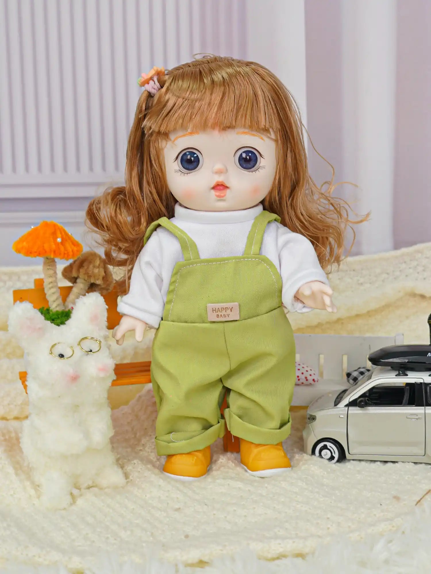 Adorable doll in bright green play overalls, holding her hand out to a cute, bespectacled plush toy.