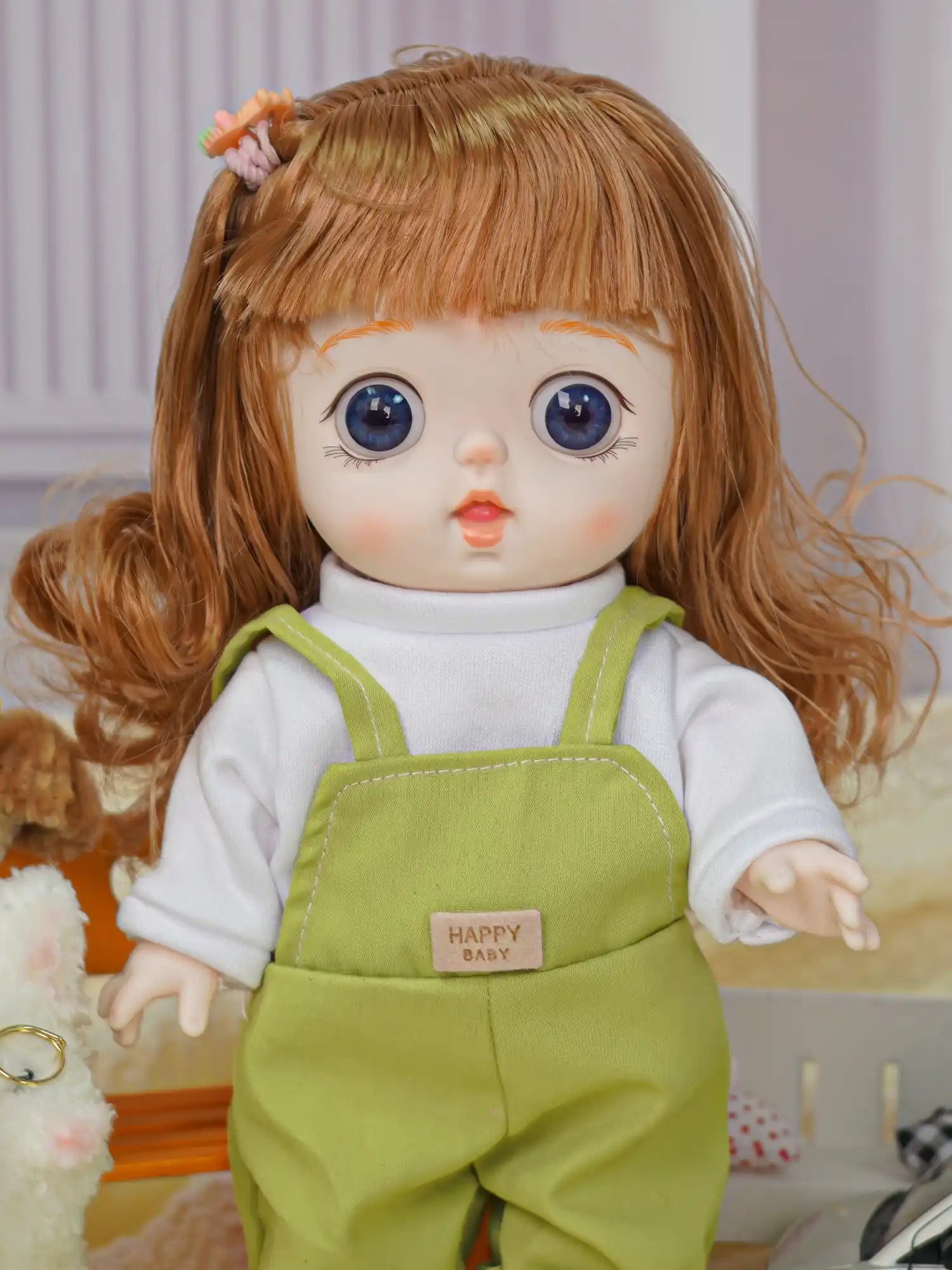 A toy doll with a tender expression, dressed in a casual outfit with a hair clip, stands by a plush kitten with glasses.