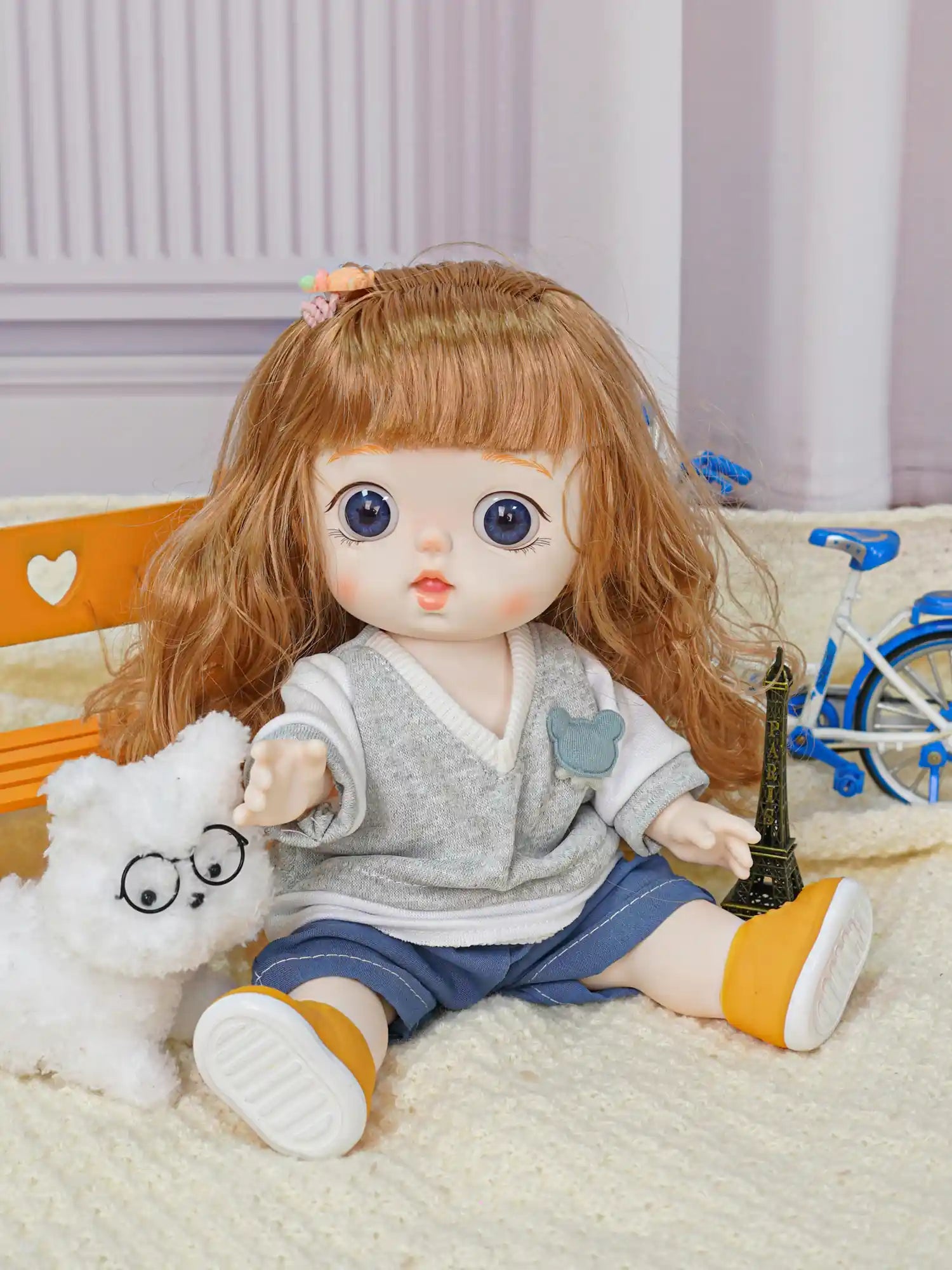 Childlike toy figure with large eyes and stylish outfit, holding hands with a white, bespectacled plush dog.