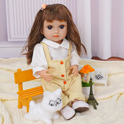 Doll with brown hair, yellow overalls, plush dog, and Eiffel Tower model.