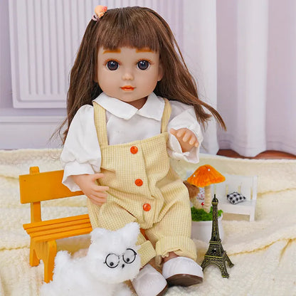 Childlike doll in white and yellow, with a toy dog and miniature Eiffel Tower.