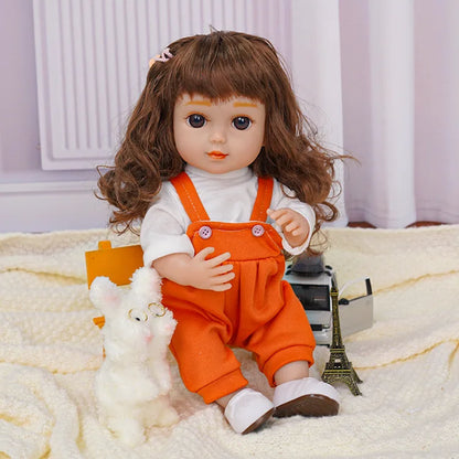 Curly-haired doll sitting, in a white top and orange pants, with a toy dog and miniature tower.