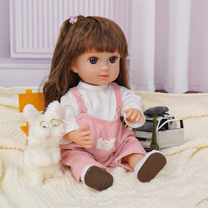 Child-like doll with toy camera, fluffy dog, and a small Eiffel Tower.