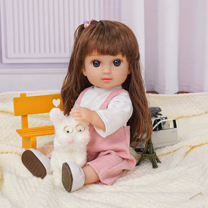 Friendly doll in pink outfit with a bespectacled toy dog and a camera.