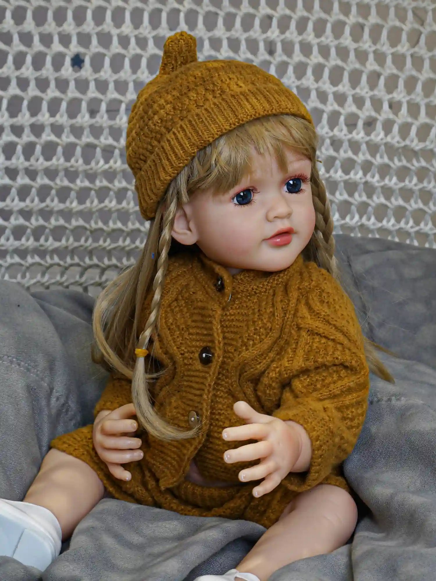 Let this reborn doll, with her oceanic blue eyes and comfortable green ensemble, be your little one's companion through adventures real and imagined.