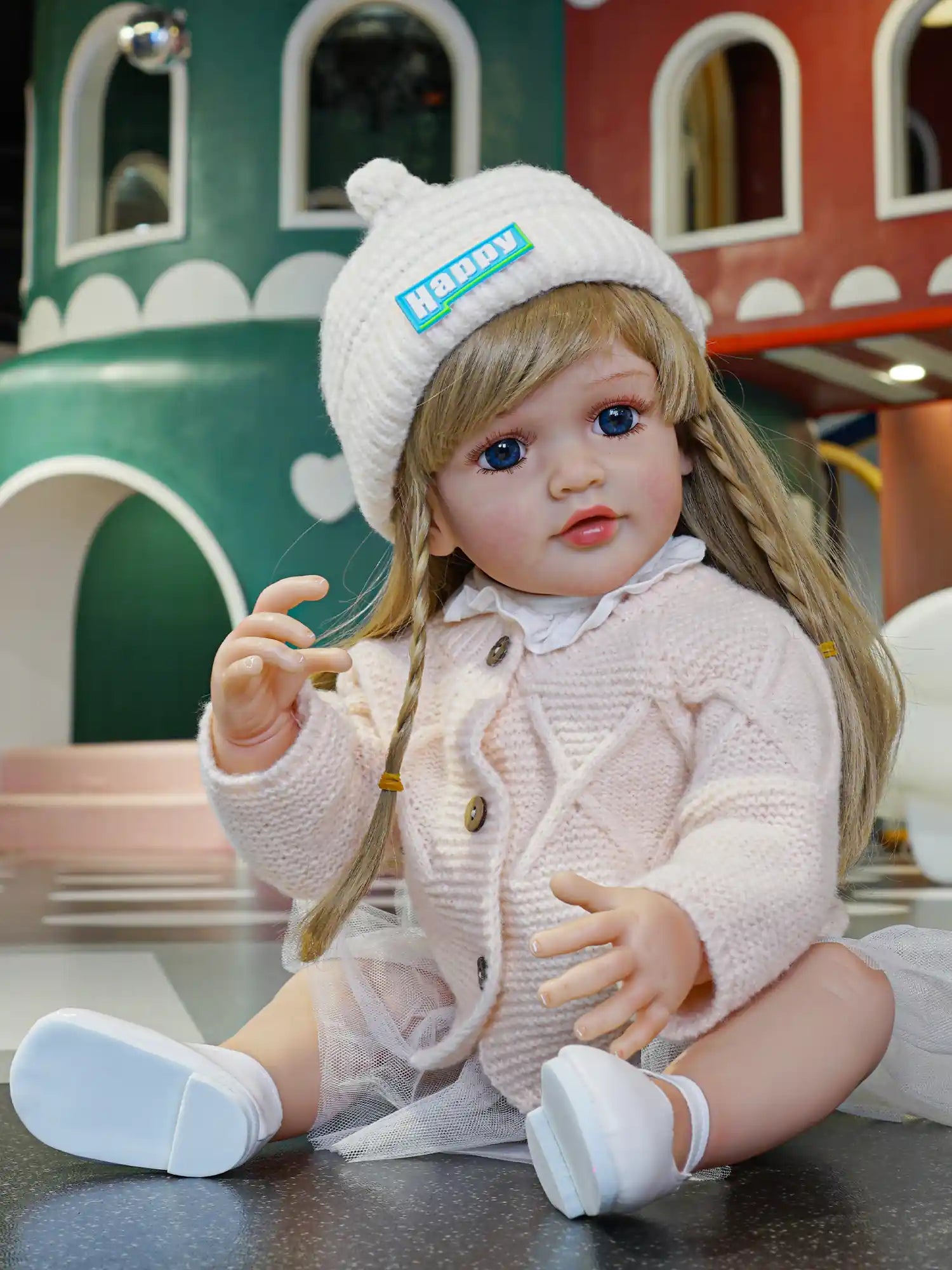 Bundle up with this sweet reborn doll, her winter-ready ensemble complete with a knit hat, is a hug waiting to happen.