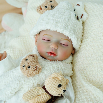 Reborn baby doll with full accessories, including bottle and pacifier.