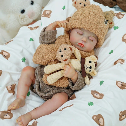 Close-up of the reborn baby doll holding a teddy bear, resting calmly.