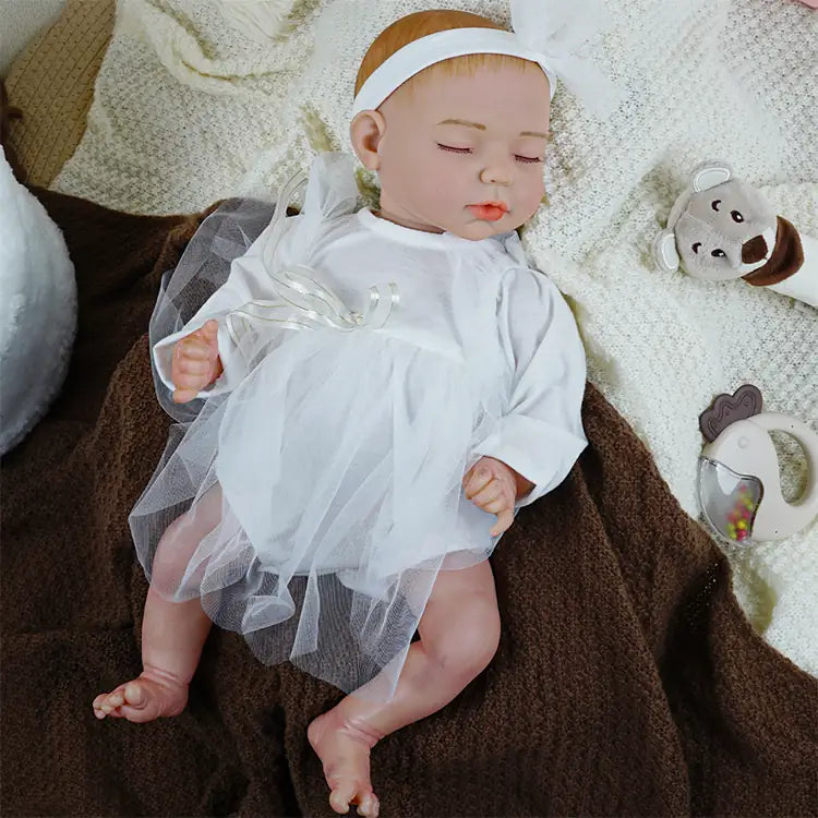 Handcrafted doll in baptismal white dress and ribbon