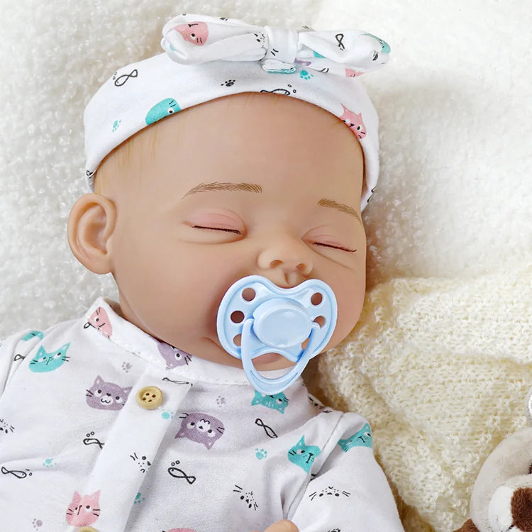 High-quality, weighted reborn doll with a birth certificate, showcasing compatibility with newborn baby clothing.