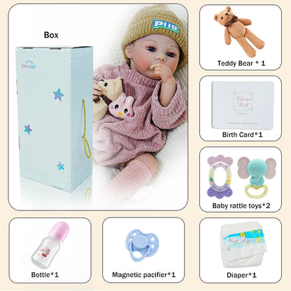 Complete set of accessories for the reborn baby doll, including a teddy bear, bottle, and pacifier.