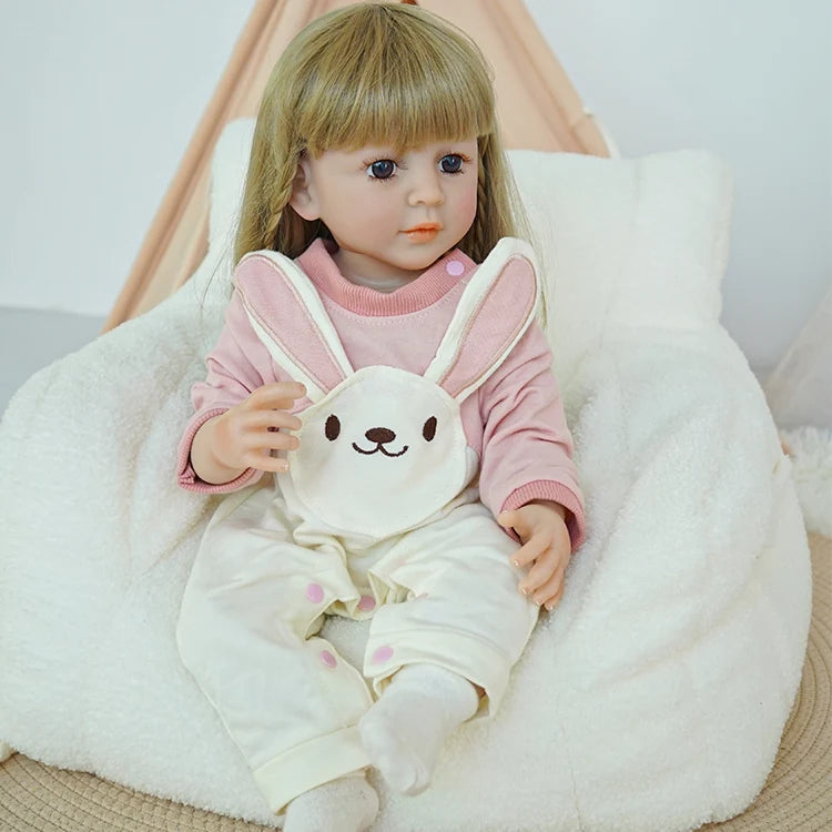 Chimidoll - reborn toddler doll, dressed in a pink bunny onesie ensemble