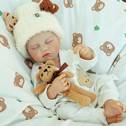 Doll hugging the teddy bear while dozing.