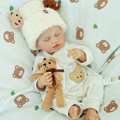 Doll holding teddy bear, relaxing with eyes closed.