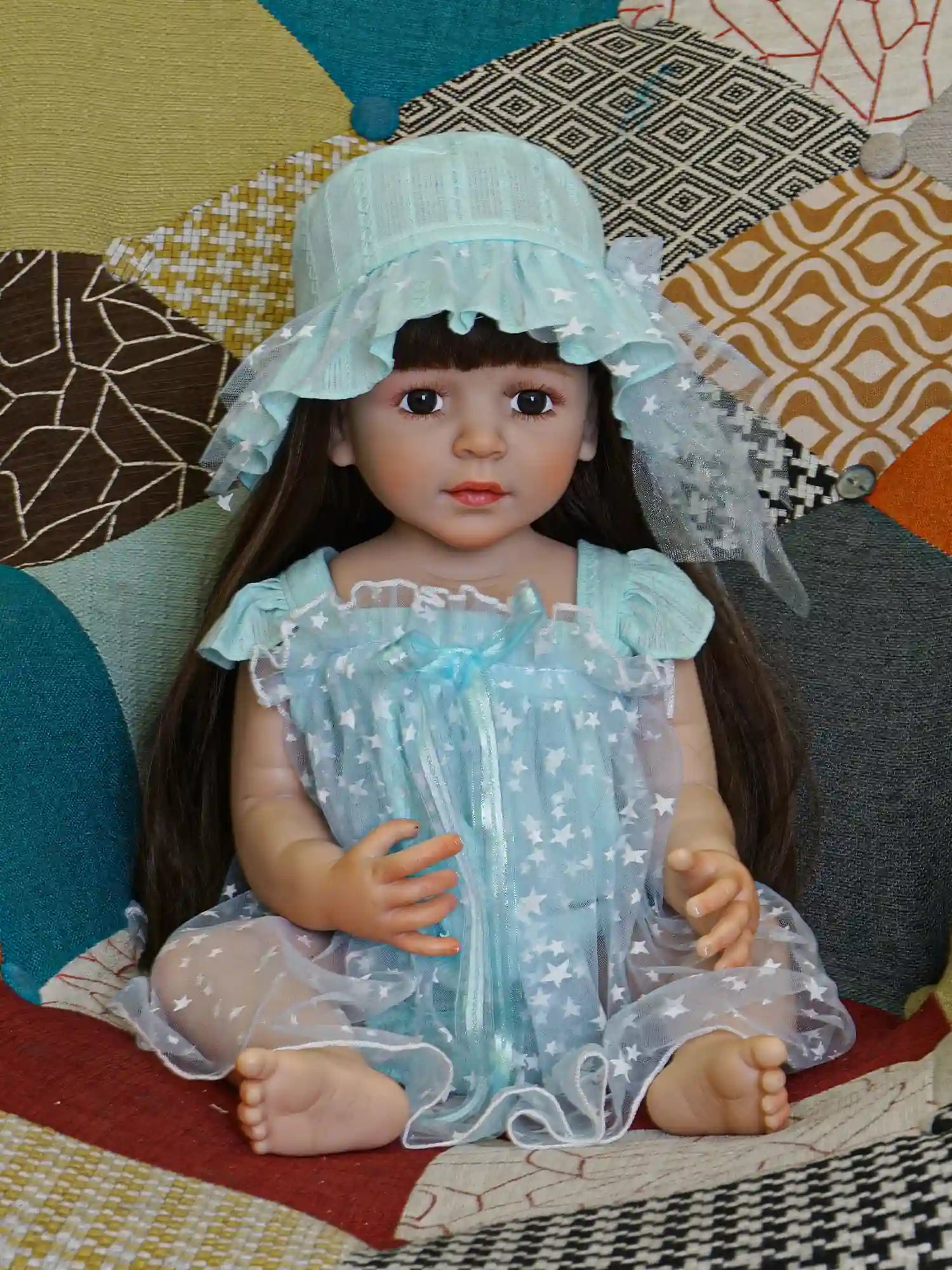 Collectible doll with star-print attire, giving off a dreamy, celestial vibe.