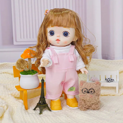 A wide-eyed doll with a charming expression, decked in a pastel outfit, alongside a quirky, bespectacled stuffed toy.