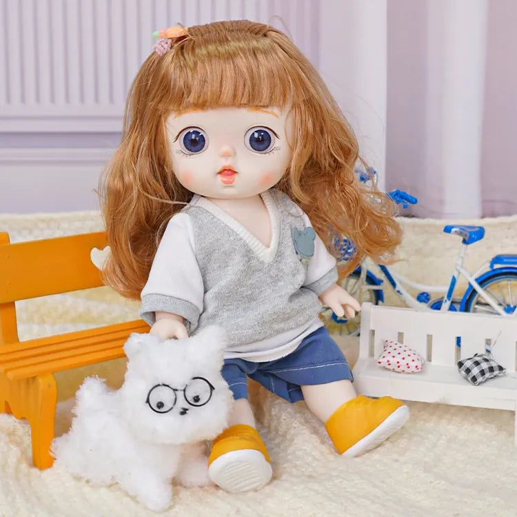 Cute doll in modern attire with a pet plush, against a backdrop of miniature furniture and a toy bike.