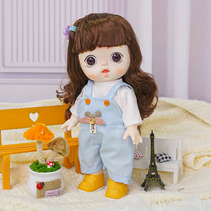 A brunette doll with lifelike eyes, dressed in cute overalls, in a setup with playful mushroom decor and a Parisian touch.