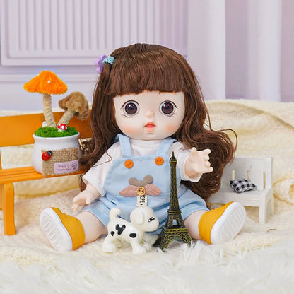 A doll with a curious expression and wavy hair, clad in a blue onesie, shares the frame with a model of the Eiffel Tower.